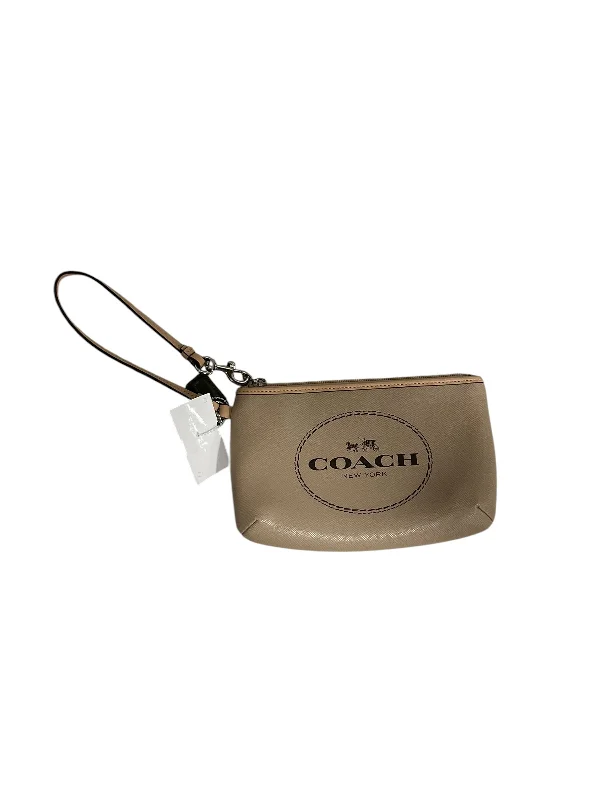 Coach bags with a chain - link trim and a leather body for a modern edgeWristlet Designer By Coach, Size: Medium