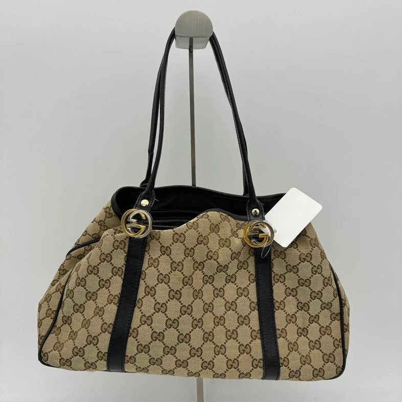 Ladies Gucci shoulder bags with a tassel decorationGucci Canvas Beige Monogram Shoulder Bag Medium Size