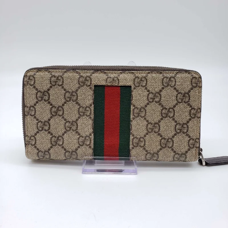 Women Gucci Sylvie bags with a crystal - embellished web stripeGucci GG Bee Zippy Wallet