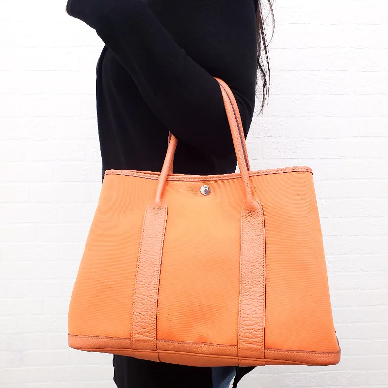 Fendi tote bags with a thermal - insulated pocket for keeping drinks hot or coldHERMES ORANGE GARDEN PM TOTE BAG