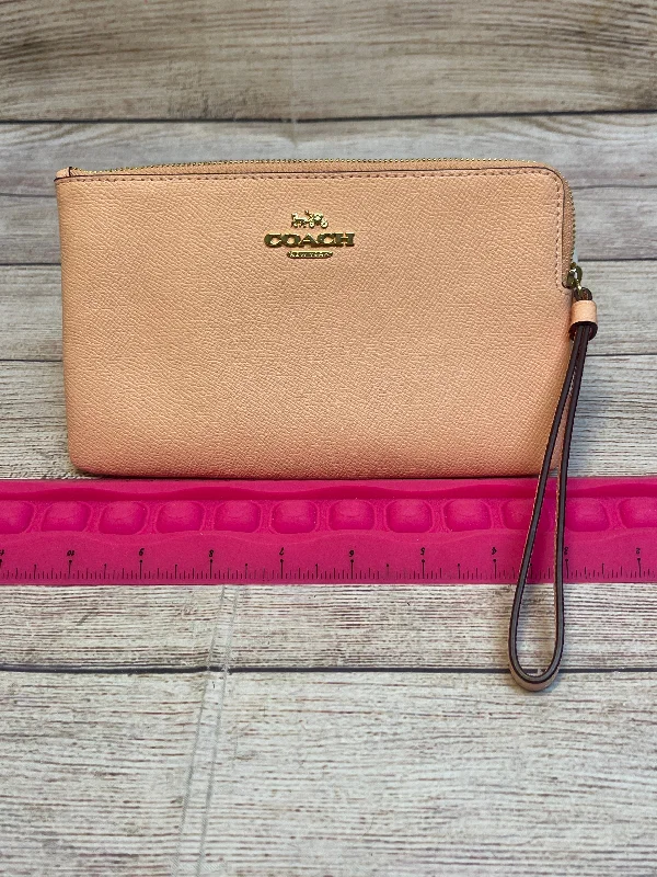 Ladies Coach Tabby bags with a textured leather surface for a more tactile lookWristlet Designer By Coach, Size: Medium