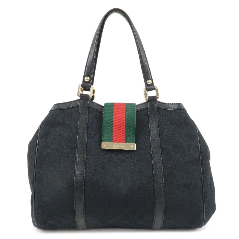 Women Gucci Sylvie bags with a crystal - embellished web stripeGUCCI Sherry GG Canvas Leather Hand Bag Black 233609